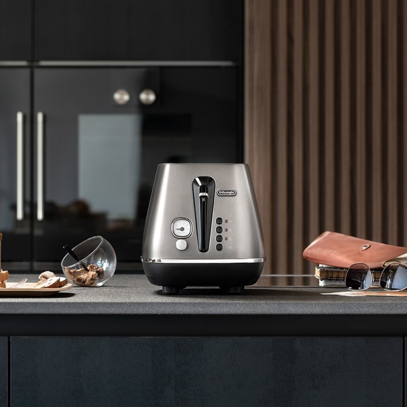 Delonghi Тостер Distinta 900Вт, метал, нековзні ніжки, титановий