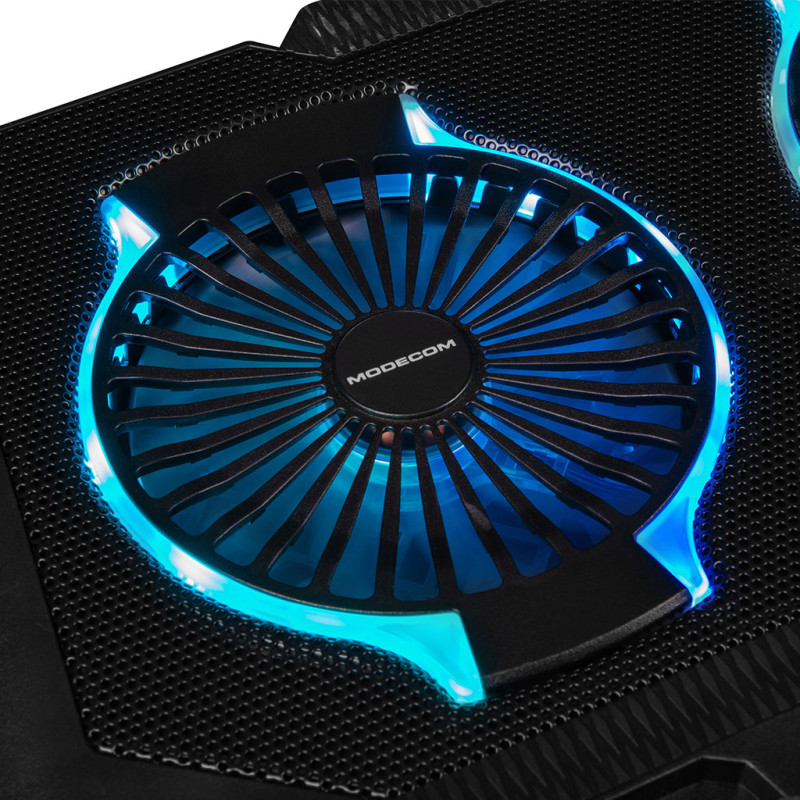 <p>Підставка для ноутбука <b>Modecom SILENT FAN MC-CF-21-RGB</b> (PL-MC-CF-21-RGB) призначена для захисту від перегрівання ноутбуків з діагоналлю до 17 дюймів. Металева сітчаста поверхня запобігає ковзанню ноутбука та сприяє кращому відведенню тепла. </p>  
<p>Два потужних вентилятори діаметром 120 мм забезпечують ефективне охолодження ноутбука. Вмикайте найбільшу швидкість обертання вентиляторів (до 1400 обертів за хвилину) та понижуйте градус при запеклих перегонах. Зменшуйте швидкість обертання та працюйте з комфортом при низькому рівні шуму. LCD дисплей дозволить легко обрати оптимальний режим охолодження. </p>
<p>Дві складні опори у нижній частині підставки забезпечують надійну фіксацію ноутбука. Висувна ніжка допоможе обрати найзручніший кут нахилу поверхні – від 4,5 до 45 градусів. Вона легко складається та роблять підставку зручною для транспортування. </p>
<p>RGB підсвічування із 10-ма режимами підкреслює ігровий характер підставки та створює динамічну атмосферу. </p>
<p>Підставка <b>Modecom SILENT FAN MC-CF-21-RGB</b> оснащена двома USB портами для підключення необхідного додаткового обладнання.</p>